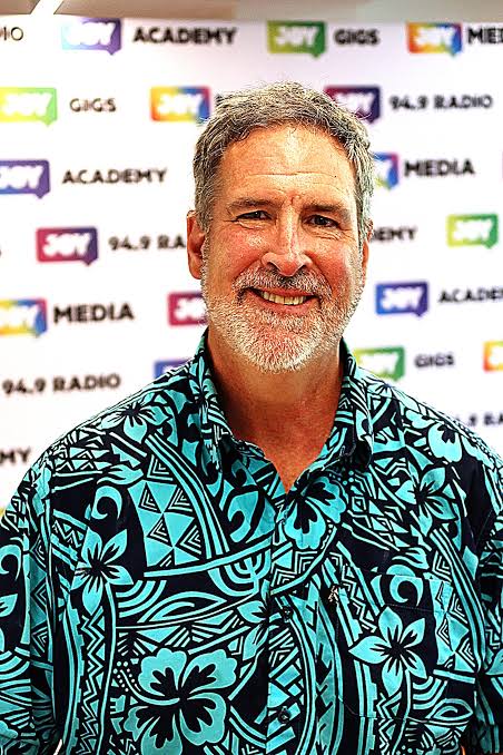  Paul Byrne-Moroney grey hair green shirt