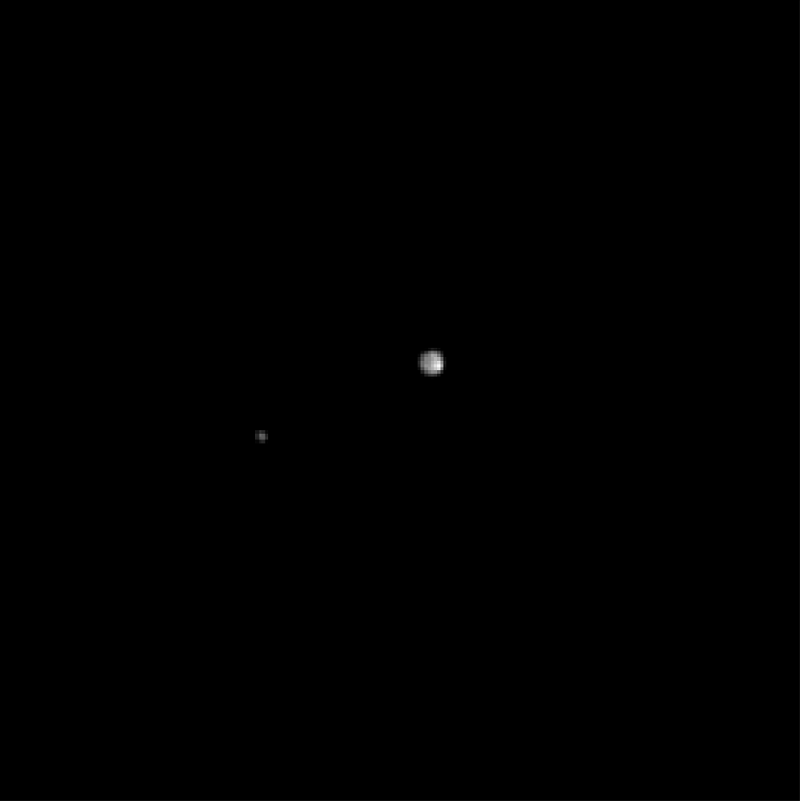 Pluto and its moon Charon, as seen by the approaching New Horizons spacecraft (NASA)