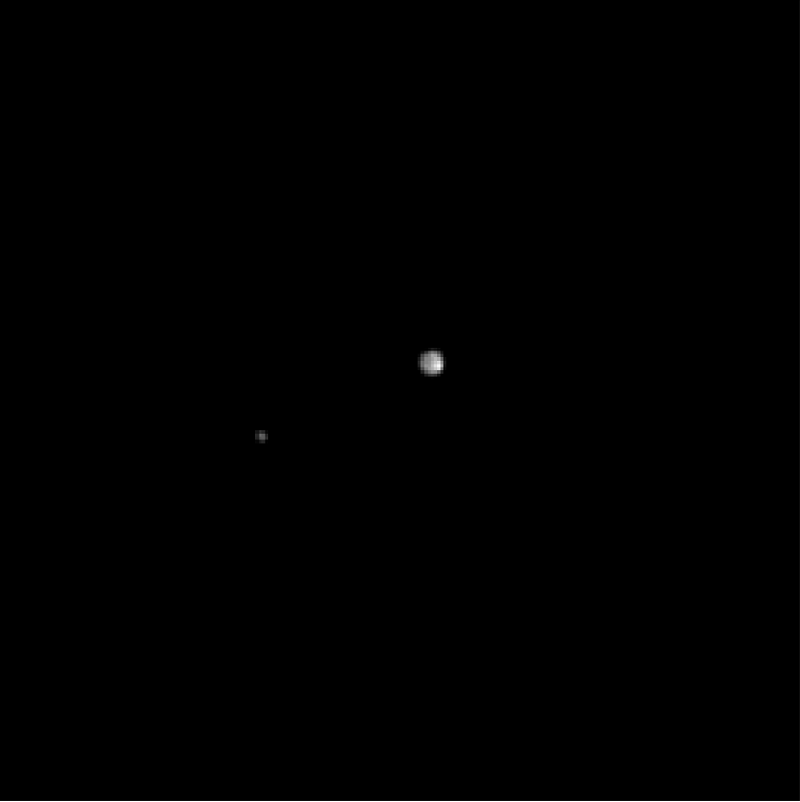 Pluto and its moon Charon, as seen by the approaching New Horizons spacecraft (NASA)