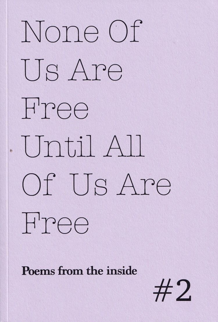 A scan of the cover of the poetry collection 'None Of Us Are Free Until All Of Us Are Free'. The cover is lavender with the title printed in black letters with the subtitle 'Poems from the Inside #2'.