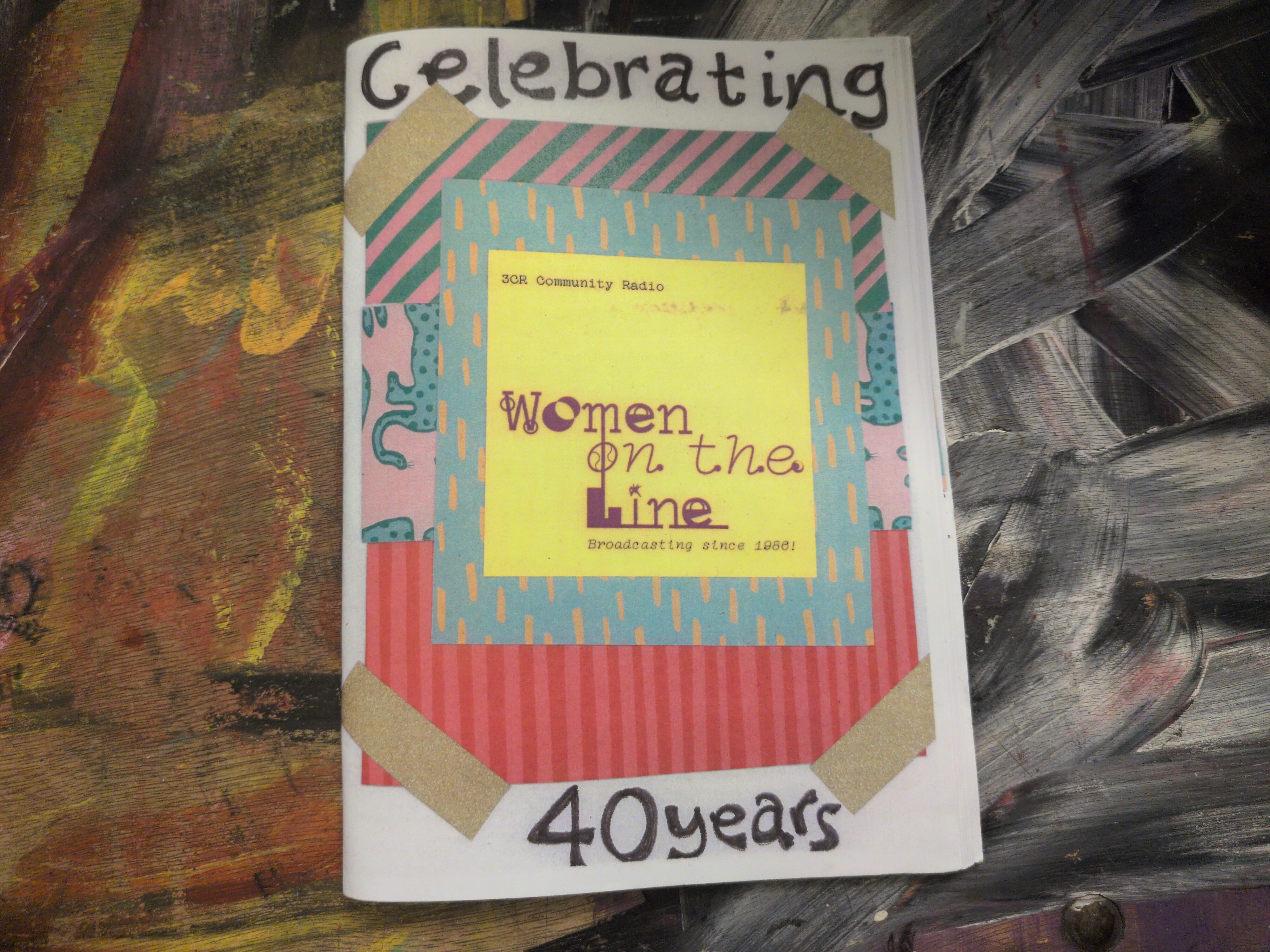 Image of zine celebrating 40 years of Women on the Line on a colourful background