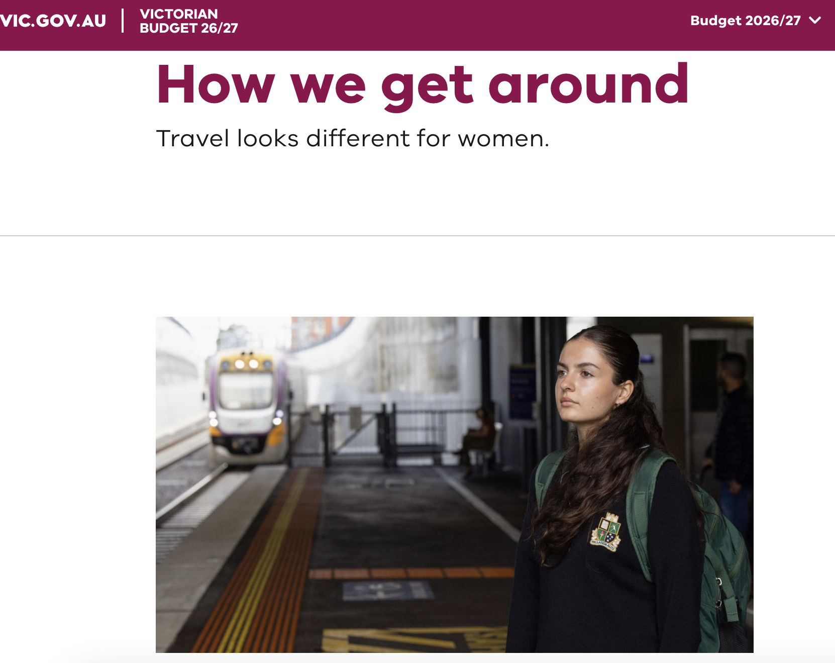 A webiste page with a maroon banner is labelled "Budget 2026/27" and has the Victorian govvernment logo. It features a photo of a women with a train in the distance and the headline reads "How we get around Travel looks different for women."  