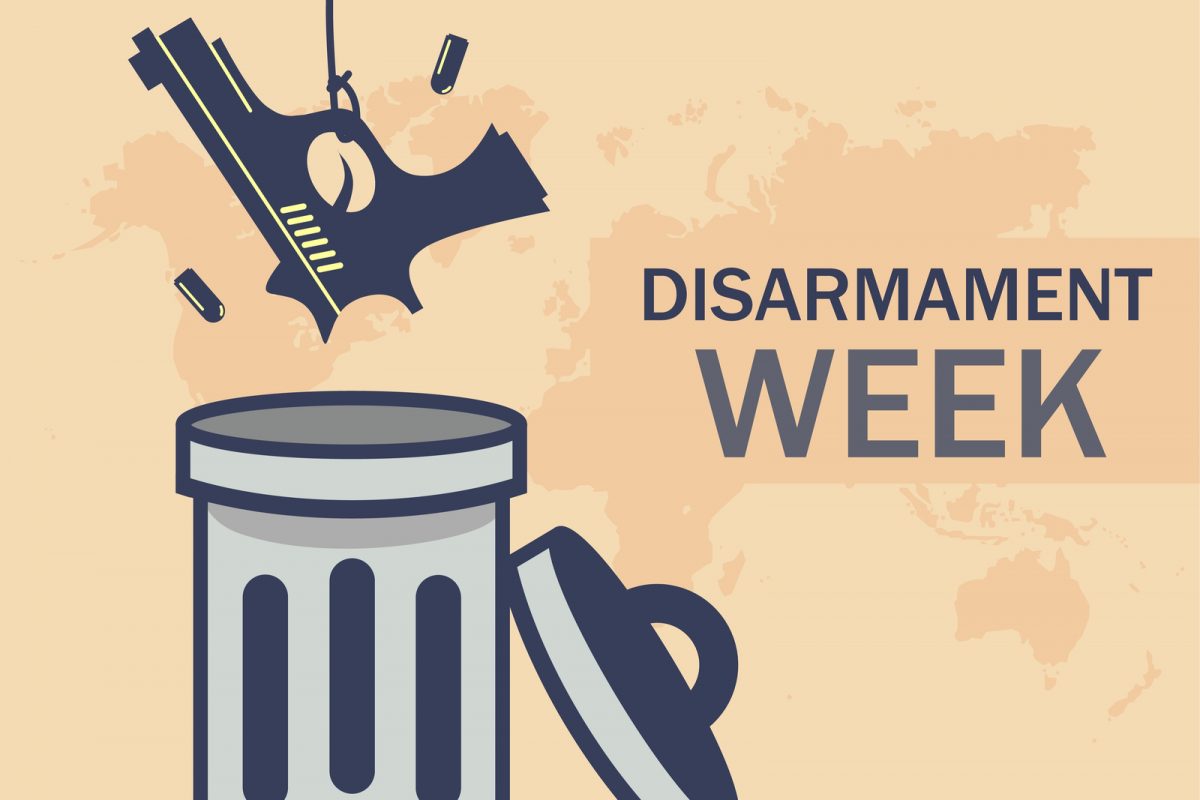 On the left there is a gun being dropped into a bin, on the right there are the words 'Disarmament Week' in capital letters, in the background there is a map of the world