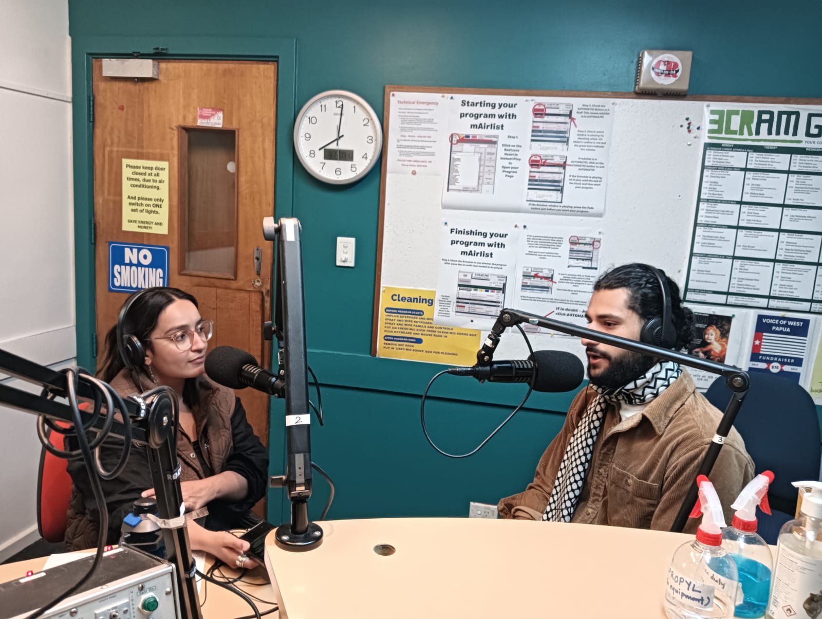 A photograph of Inez Winters and Ahmed Barakat in the 3CR studio.