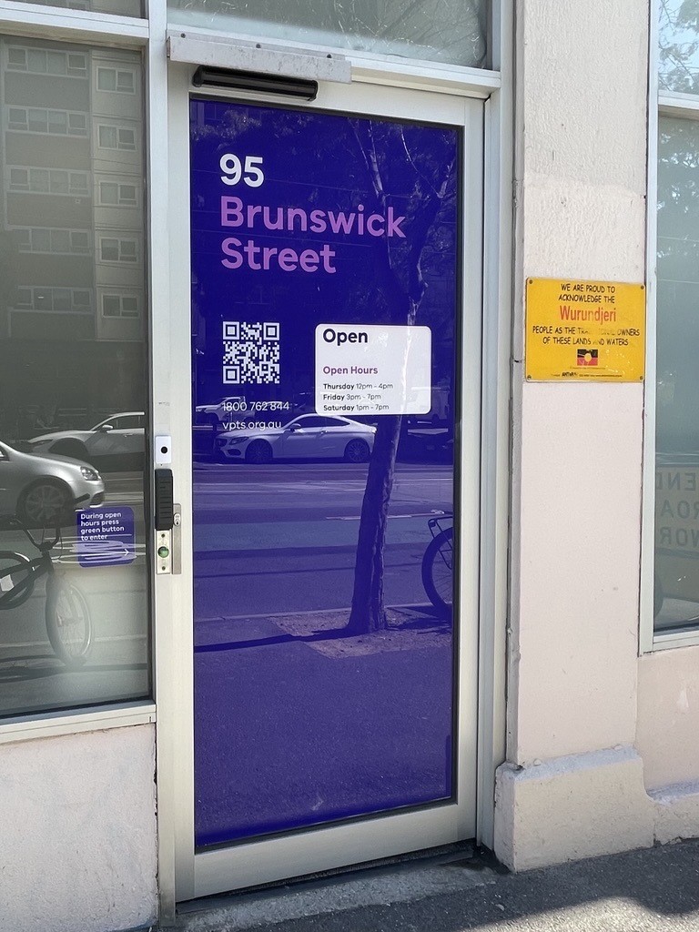 Purple glass door entrance to Victorian Pill Testing Service at 95 Brunswick St, Fitzroy VIC 3065.