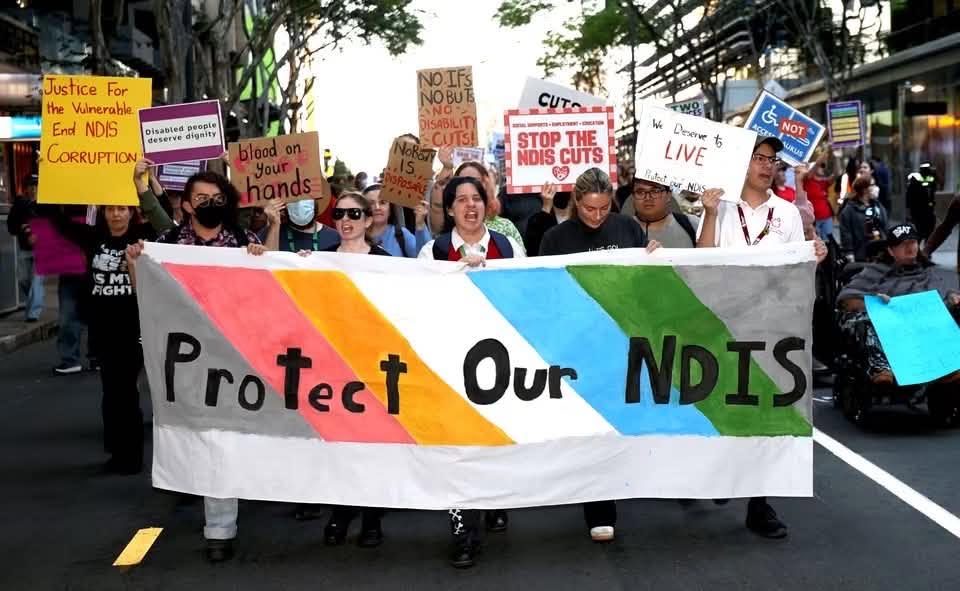 Protect Our NDIS Rally: People holding banners