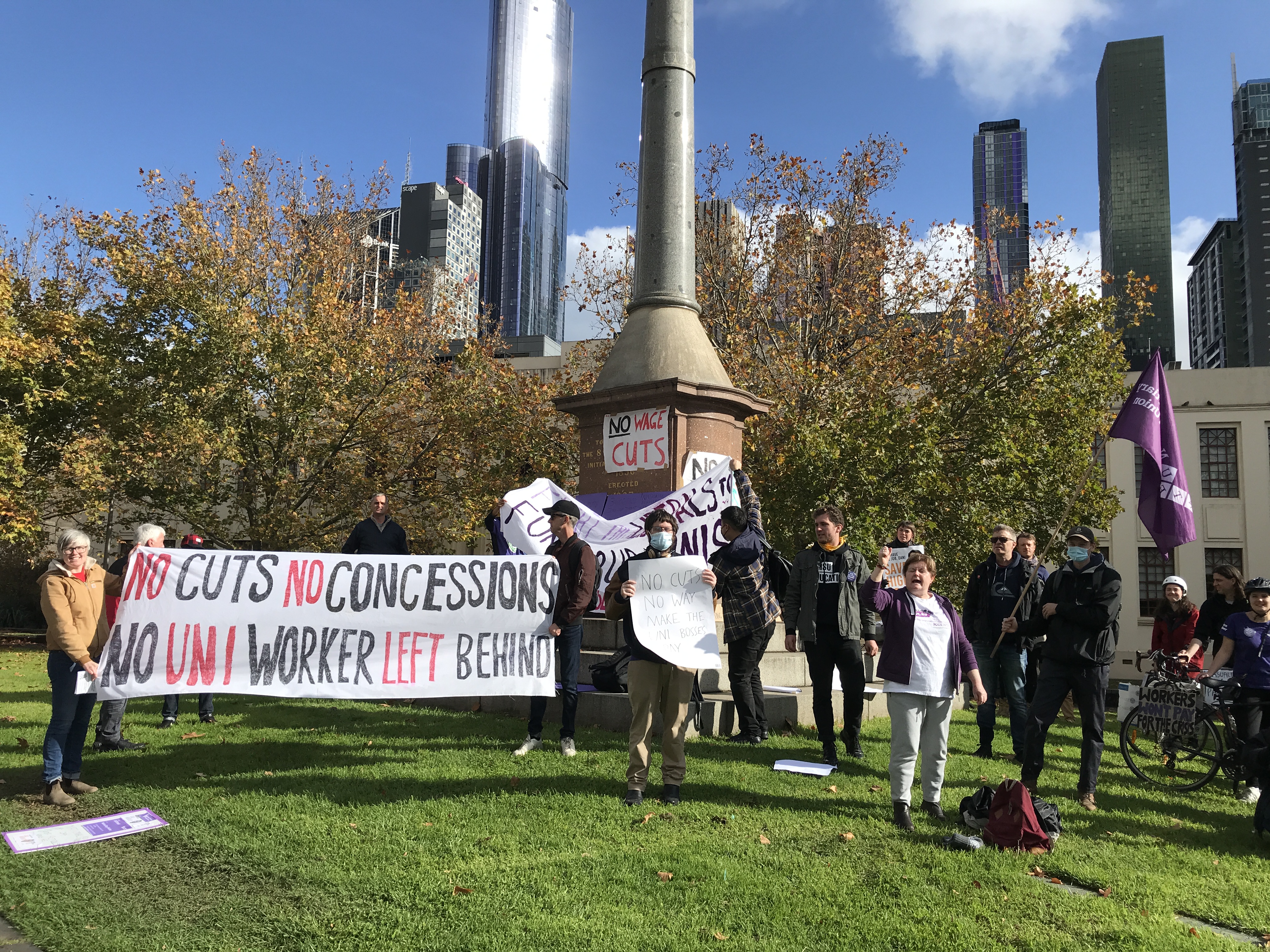 Image of NTEU workers and banners at the 8 Hour Day Monument in so-called Melbourne