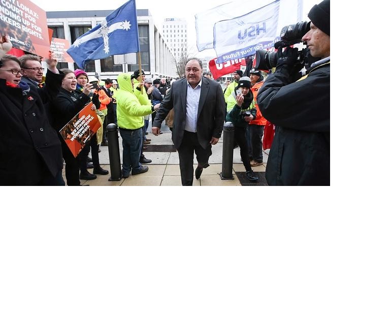 Former Canberra Raider player and CFMEU official John Lomax is cheered on by supporters. Picture: Kym Smith 