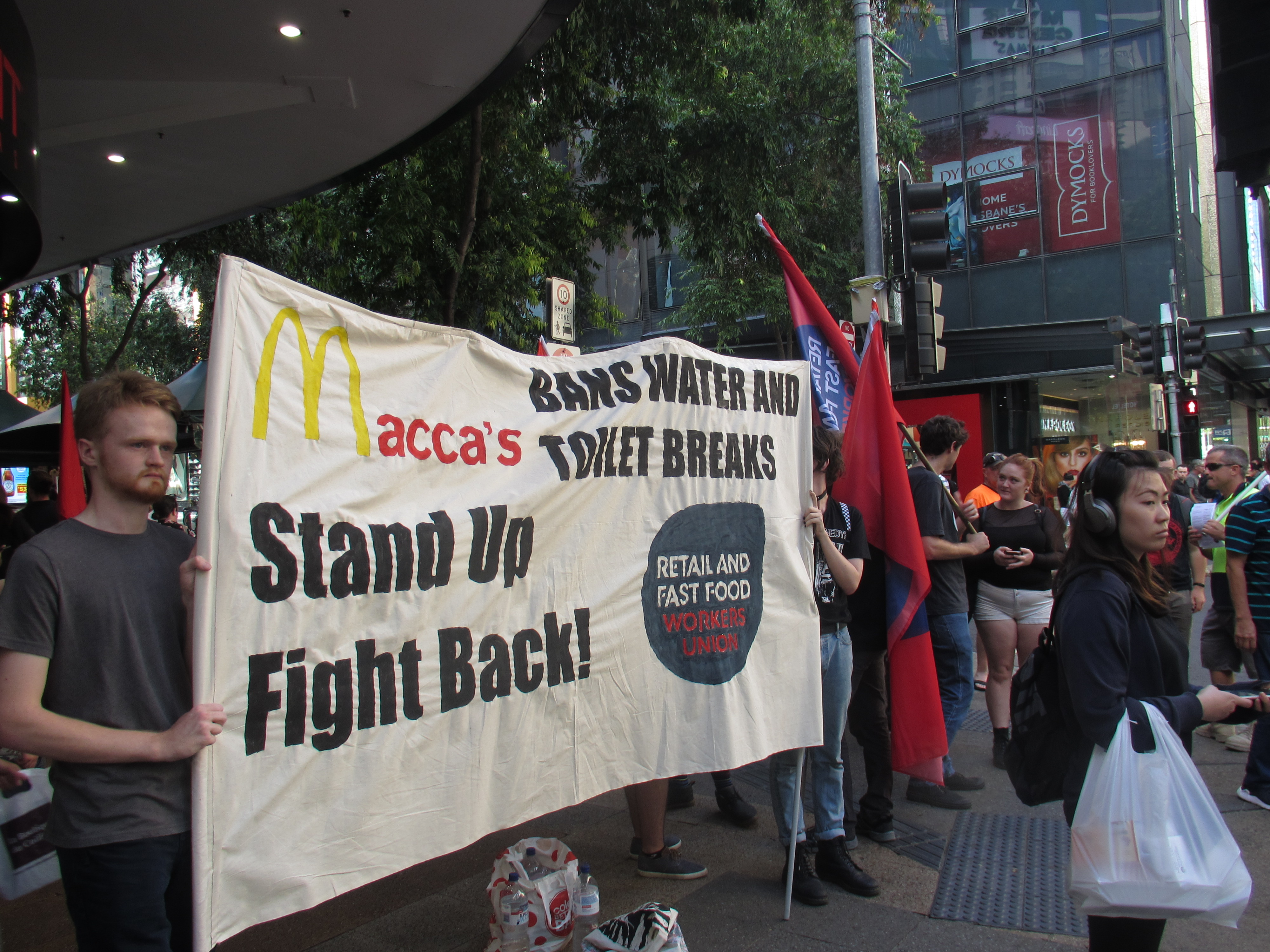 Workers protest out the front of a MacDonalds store in Brisbane