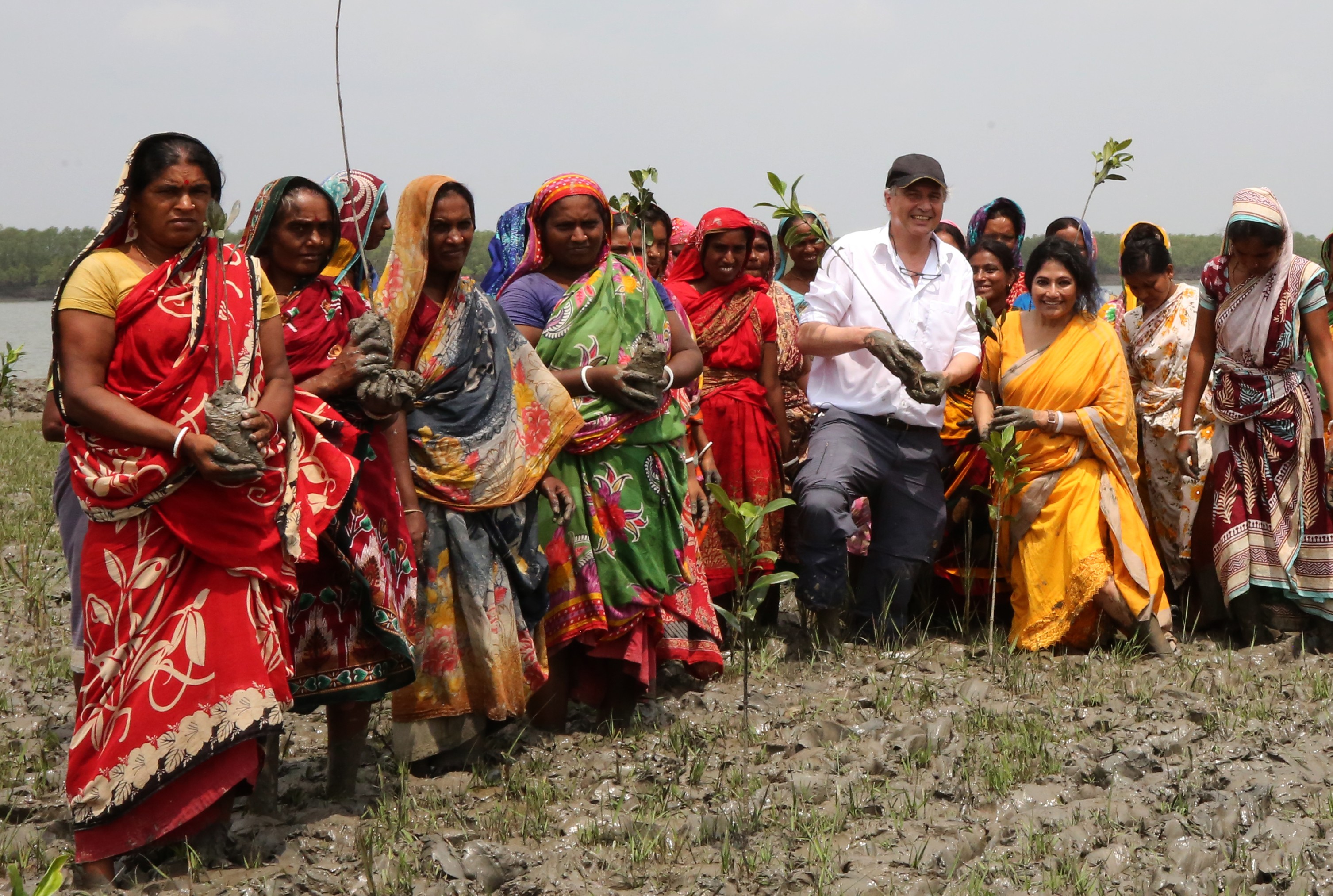 Runa Khan founder of "Friendship NGO" with Bangladeshi people planting mangroves. Photo Supplied