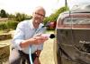 Robert Llewellyn plugging in electric vehicle