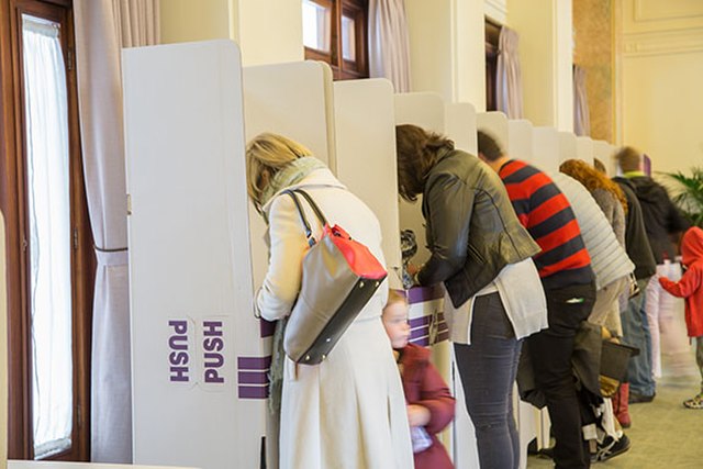 People casting their votes at an Australian federal election voting booths.