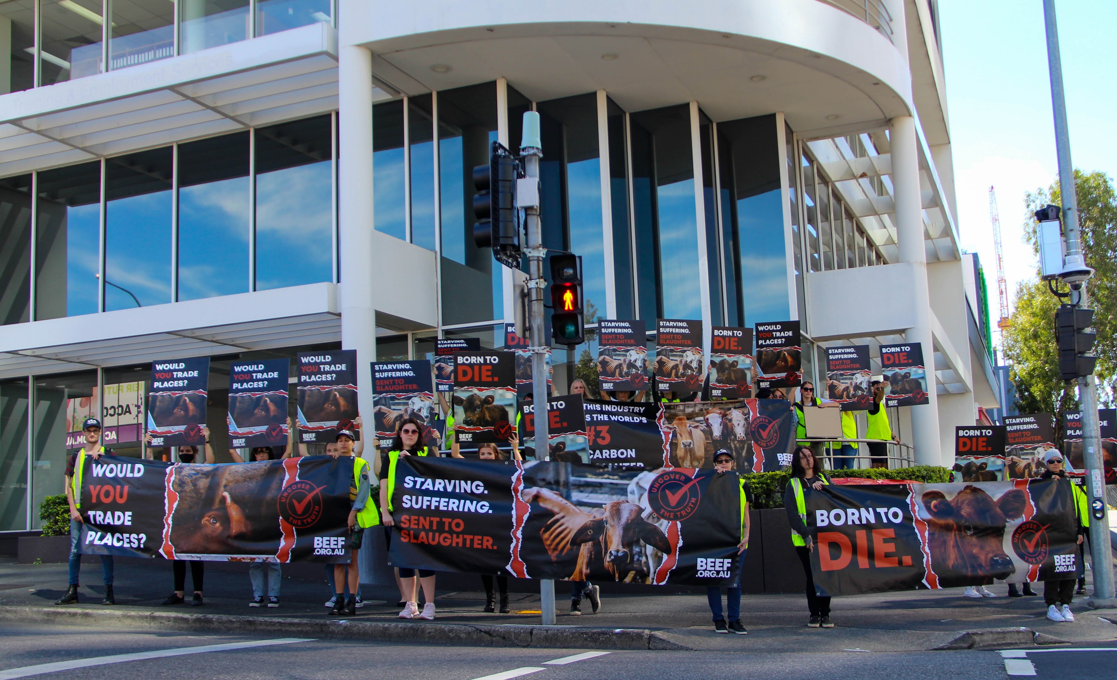  Image of participants in the BEEF.ORG.AU campaign holding posters and banners in Queensland in May 2021.