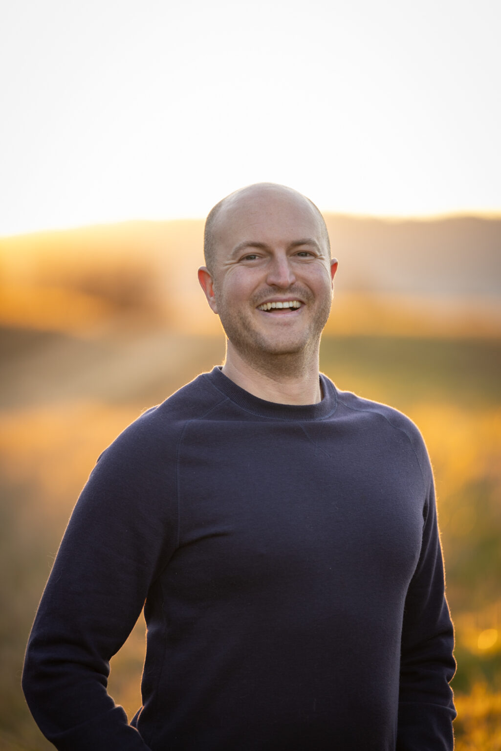 Guest Kyle Behrend standing out in a field