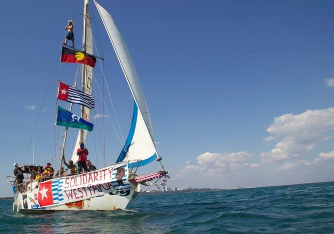 Sail boat with First Nation & West Papuan flags