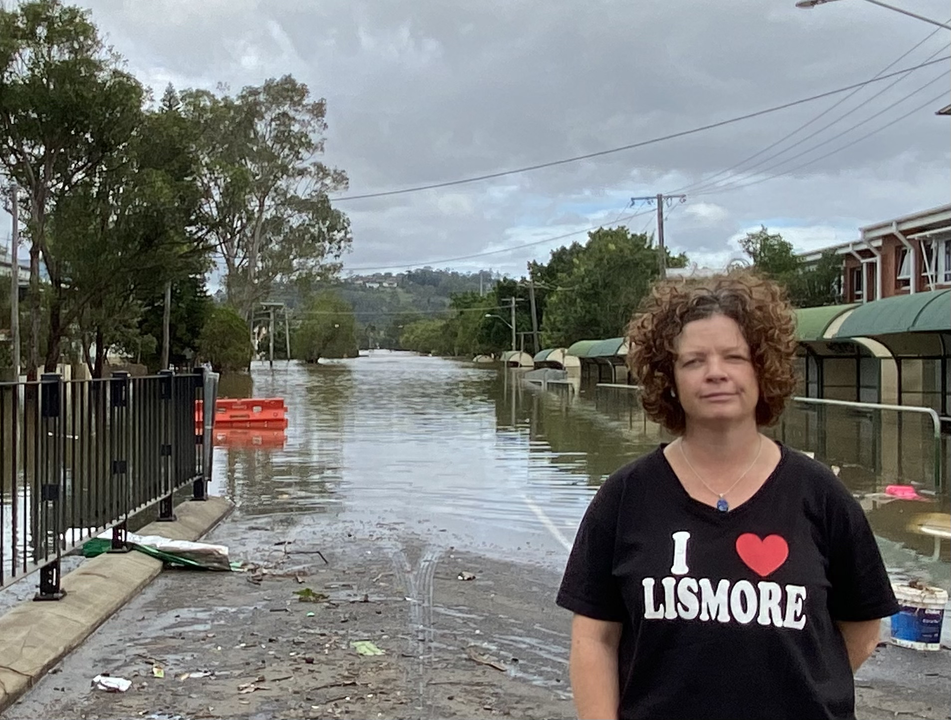 Elly Bird standing in font of Lismore Flood