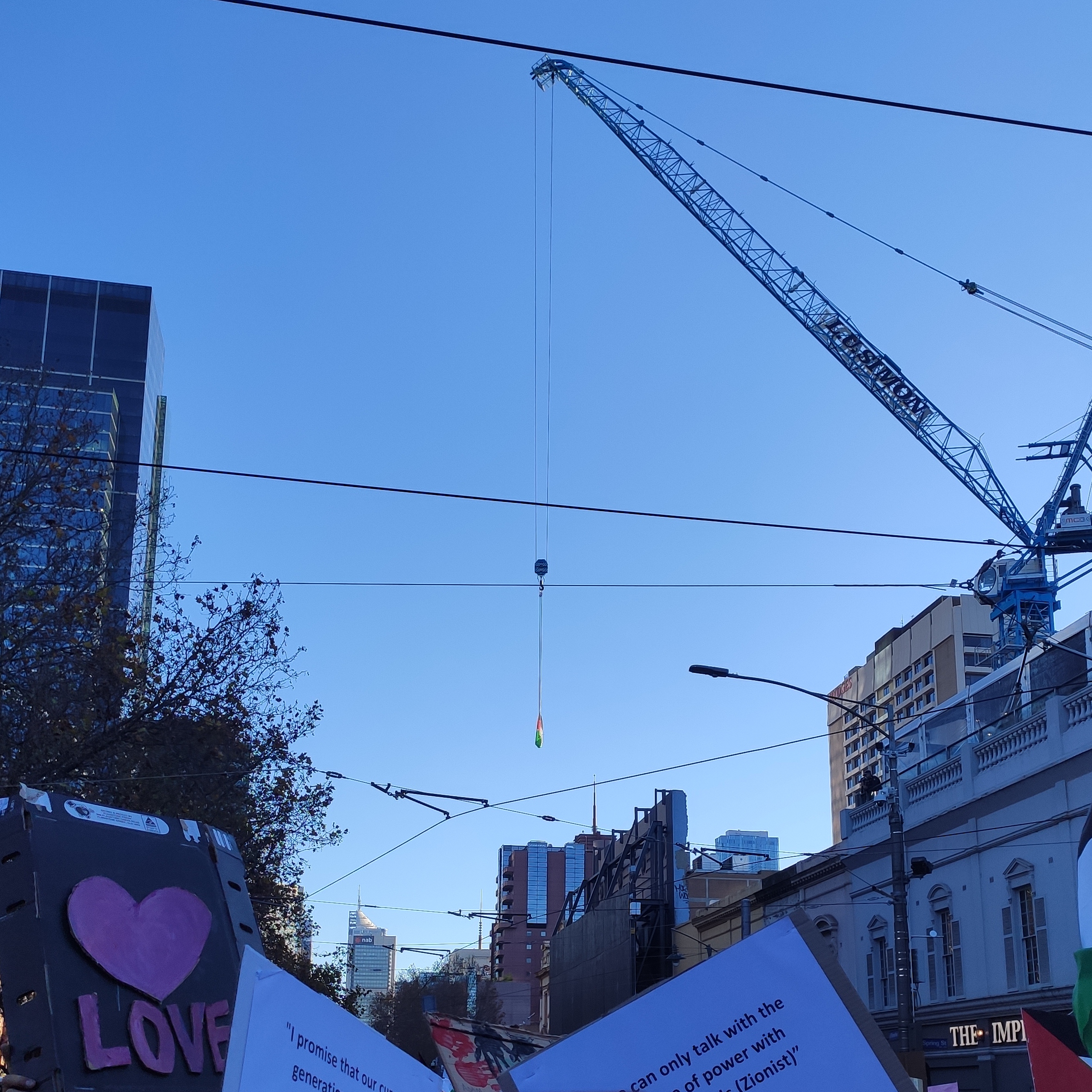 The moment at the May 22nd Free Palestine rally workers in solidarity flew the Palestinean flag