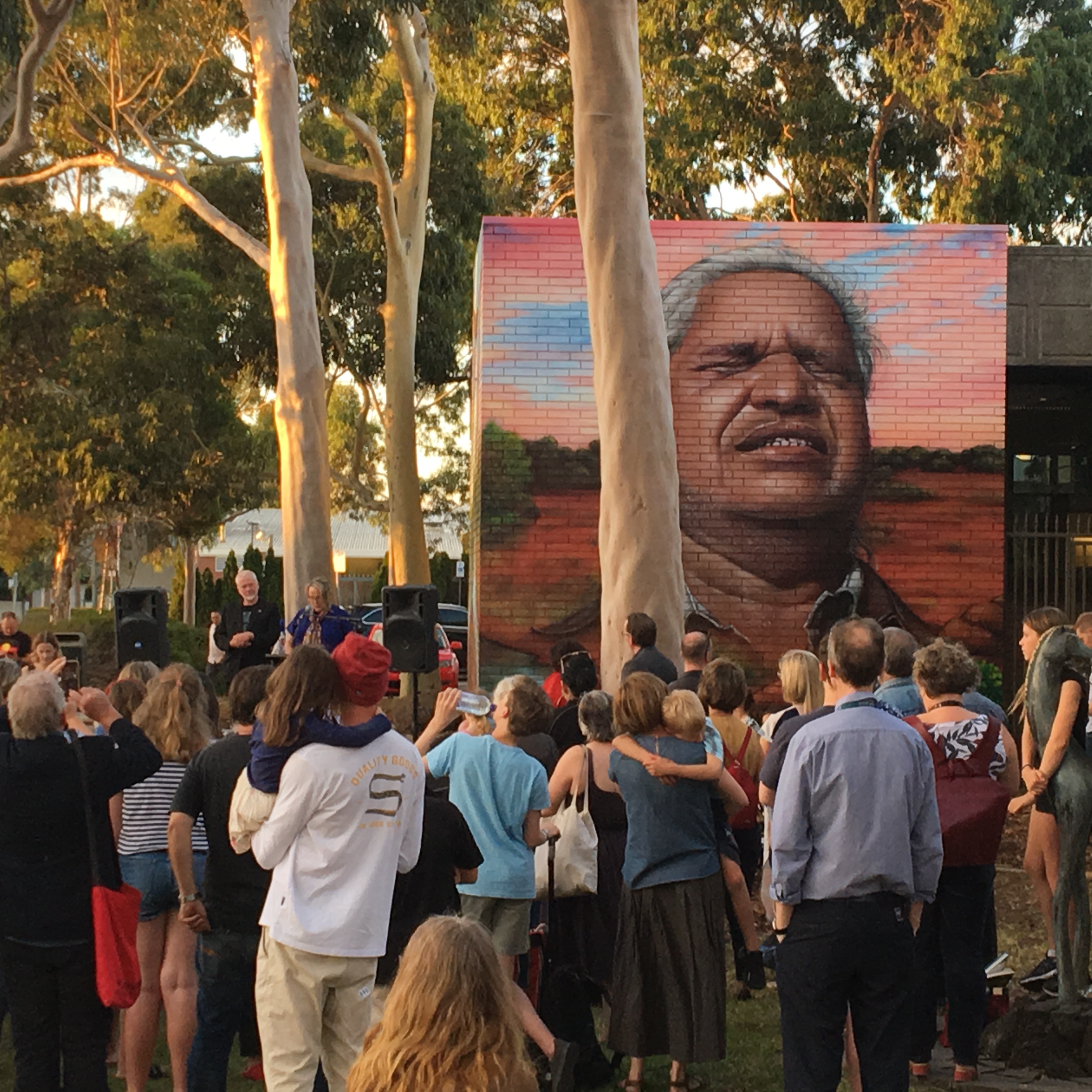 Crowd gathered for the ICAN mural launch at the Preston library in Darebin, featuring a portrait of Yami Lester.