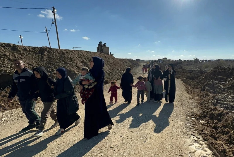 Palestinians near the Netzarim corridor, 27 January 2025. Omar AshtawyAPAimages