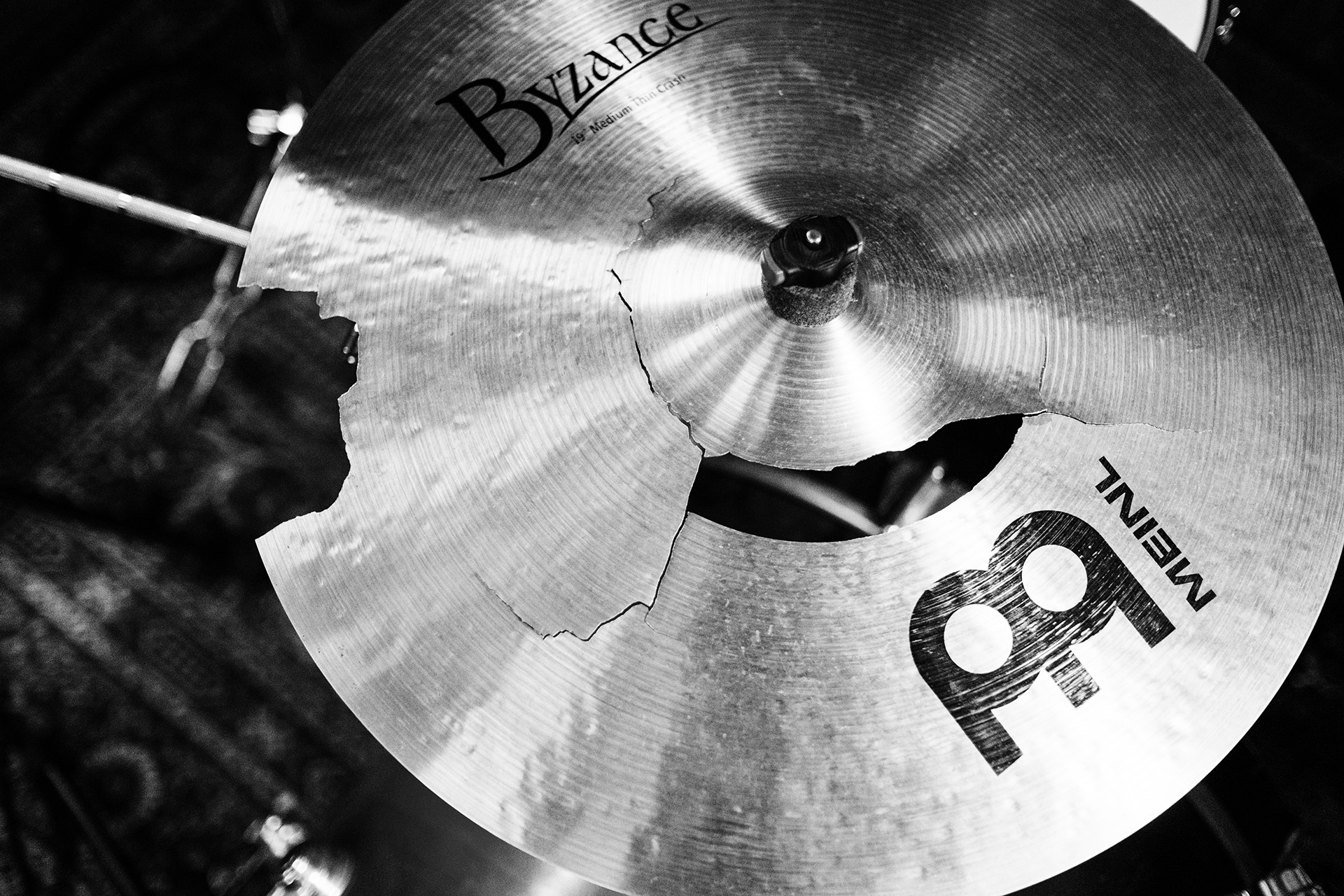 An overhead view of a rock drum kit cymbal, cracked and broken from being hit too hard!