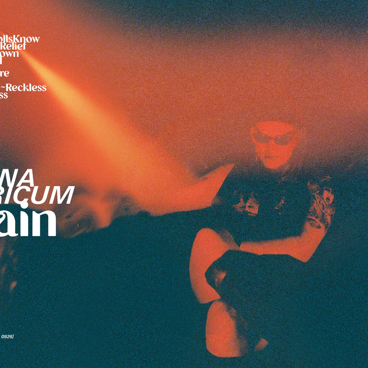 The album artwork for Villain, featuring a smoky orange and black background with the artist Simona Castricum in front wearing black sunglasses