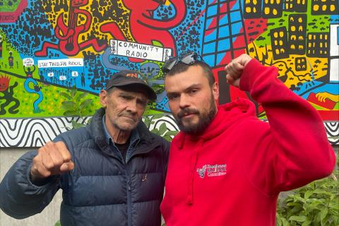 Keiran Stewart-Assheton and Djuran Bunjileenee Robbie Thorpe in the 3CR garden, raising their fists