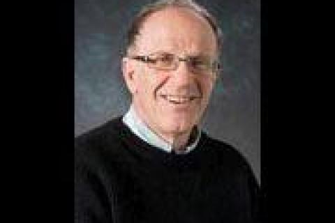 Dennis Altman grey hair glasses navy sweater