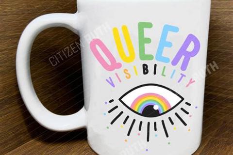 beverage mug with word queer in rainbow colours and eye with lashes