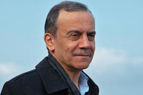 Ahmad Kaabour close-up in front of a blue sky