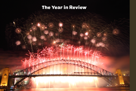 Fireworks over the top of Sydney Harbour Bridge with the text The Year in Review