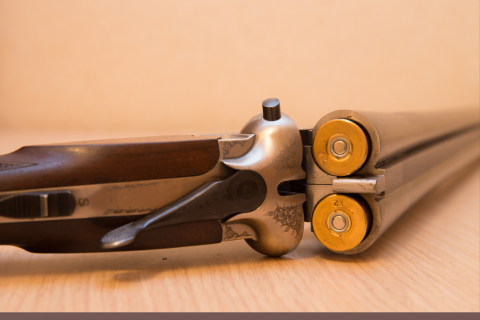 An image of an open double barrel shot gun