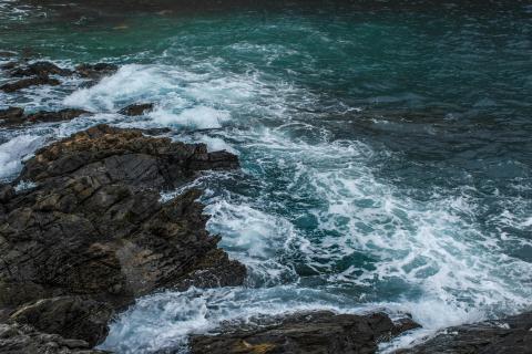 Rocky shoreline with waves crashing