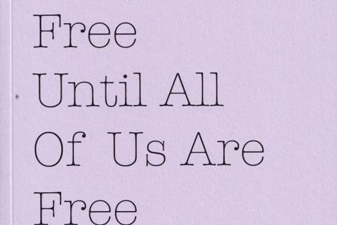 A scan of the cover of the poetry collection 'None Of Us Are Free Until All Of Us Are Free'. The cover is lavender with the title printed in black letters with the subtitle 'Poems from the Inside #2'.