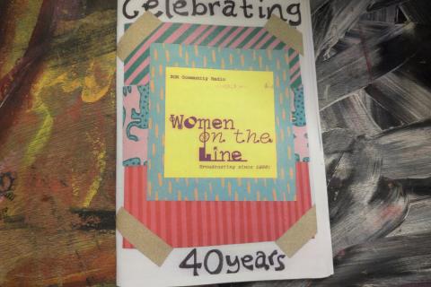 Image of zine celebrating 40 years of Women on the Line on a colourful background