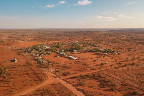 Aerial view of remote, outback town with red dirt