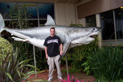 The presenter with a model of a male great white shark at the entrance to the Natal Sharks Board, South Africa