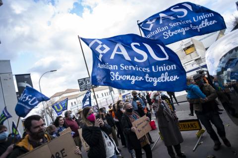 Photograph of council workers marching in 2021 holding banners reading "ASU AUSTRALIAN SERVICES UNION STRONGER TOGETHER".