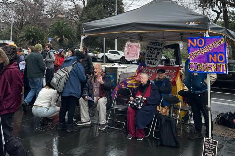 Older public tenants and supporters gather outside Housing Minister Nick Staikos' office at 1 Spring Street on the 5th of August, 2026.
