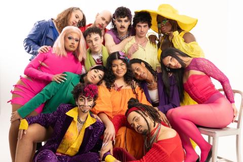 Queer Connect's Choosing Love Cover Photo. Featuring 13 queer creatives huddling together in bright colorful clothing with a white background. 