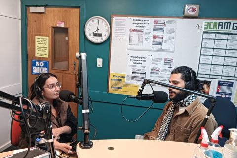 A photograph of Inez Winters and Ahmed Barakat in the 3CR studio.