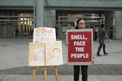 Krishna Ariola Philippines Activist outside Shell HQ.Photo Credit Greenpeace