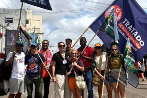 KUMI NAIDOO (3rdfrom left) Phasing our Fossil Fuels at Belem-Photo supplied