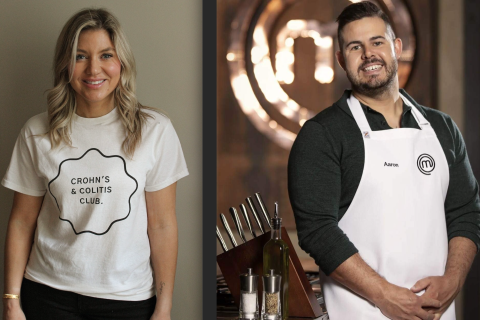 A caucasian woman with long blonde hair wearing a white shirt and black pants stands against a white wall, she is smiling, and a man stands next to her. He is caucasian and is wearing a white MasterChef Australia apron and a black long sleeved shirt, he has short brown hair and beard and is smiling.