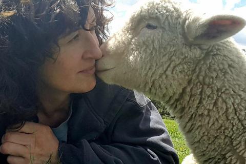 Image of Robyn with Ben, one of the lambs she raised. Image supplied by Robyn.