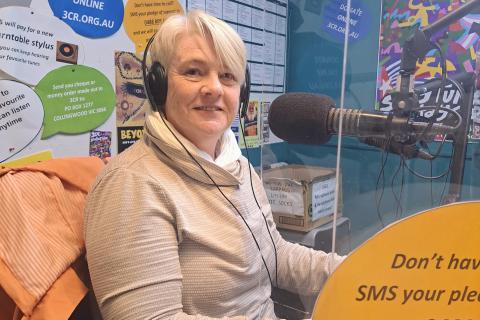 Dr Ann Enright sitting at the microphone live in the studio
