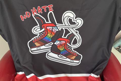 Claire's player's against hate hockey jersey