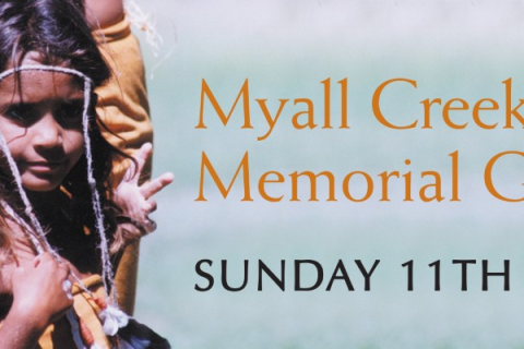 Banner image of an Aboriginal child smiling, dressed in natural fibres and feathers with text that reads: Myall Creek Massacre Memorial Gathering - SUNDAY 11th JUNE 2023