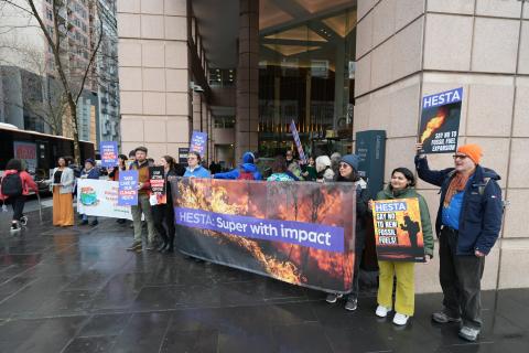 People holding a banner about HESTA