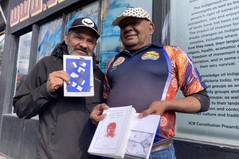 Robbie Thorpe and Lionel Fogarty at 3CR with a selection of Lionel's poetry books.