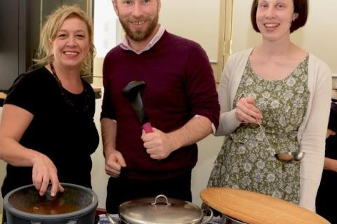 Melis, Shane and Naomi from HAAG serve soup at a recent general meeting